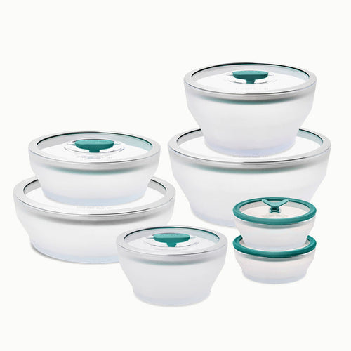 A 14-Piece Glass Round Dish Set featuring six clear frosted glass dishes with white lids and teal accents, neatly arranged from largest to smallest—an ideal plastic-free kitchen solution.