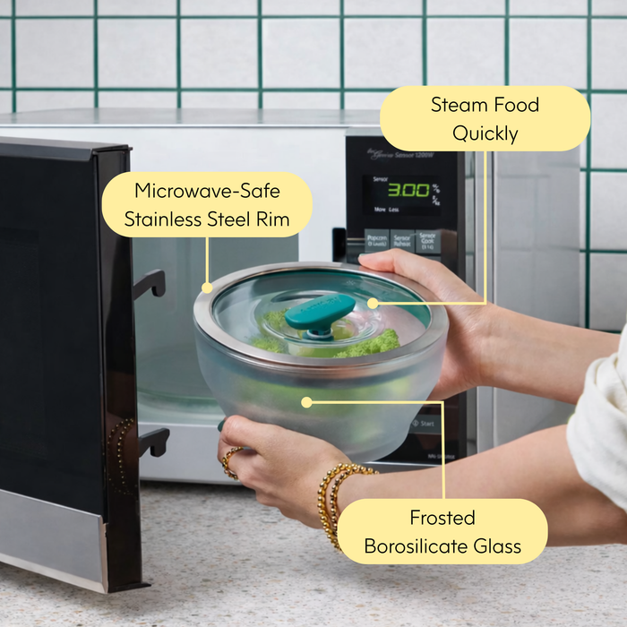 A person places a frosted glass bowl with a stainless steel rim and teal steam vent lid from the 8-Piece Frosted Glass Round Dish Starter Set into a microwave, highlighting features like safe food steaming, microwave compatibility, and durable borosilicate glass—making it an ideal addition to any kitchen or dishware collection.