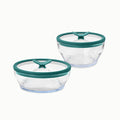 A 4-Piece Glass Round Dish Set is shown side by side on a white background, featuring clear glass food storage containers with green lids that have triangular tabs for easy opening.