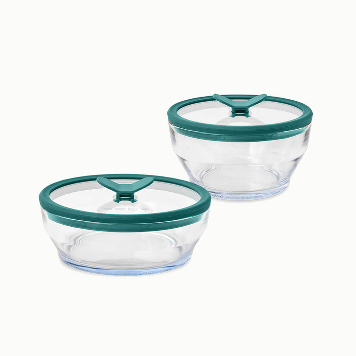 A 4-Piece Glass Round Dish Set is shown side by side on a white background, featuring clear glass food storage containers with green lids that have triangular tabs for easy opening.