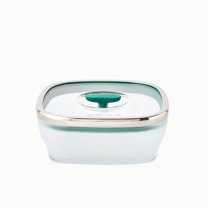 The 5.5-Cup Glass Square Shallow Dish is a transparent, square-shaped food storage container ideal for steaming asparagus in the microwave. It comes with a green-tinted, airtight lid accented by a silver rim and a dark green center tab.