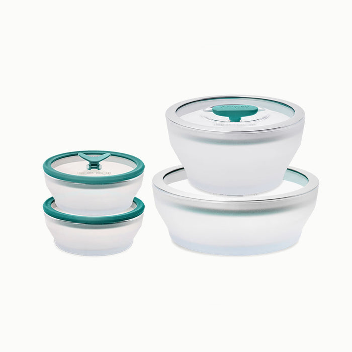 The 8-Piece Glass Round Dish Small Spaces Set is shown with four transparent glass food storage containers in two sizes, each paired and stacked. Featuring teal vented glass lids, these empty containers are perfect as microwave cookware and are displayed against a plain white background.