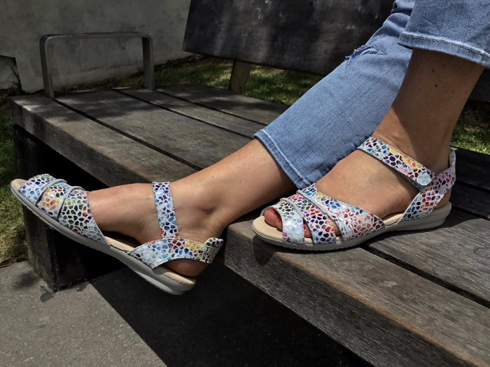 Quality European women's sandals with Velcro strap. Comfortable flat sandals with soft leather in white multi.