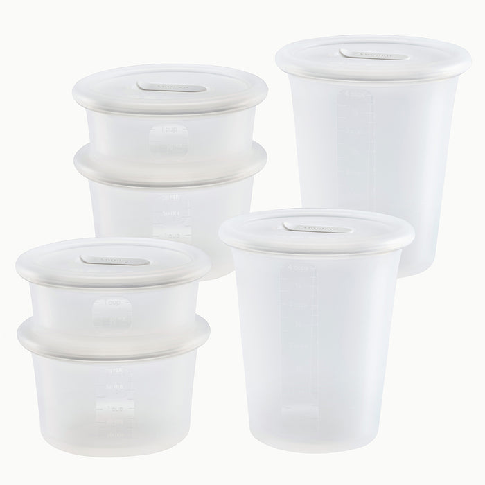 Six Anydeli Mixed Set plastic food storage containers with matching lids, arranged in two stacks and one single container. Each reusable container is translucent and features measurement markings on the side for easy and efficient portioning. Set displayed against a plain white background.
