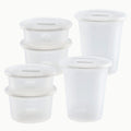 Six Anydeli Mixed Set plastic food storage containers with matching lids, arranged in two stacks and one single container. Each reusable container is translucent and features measurement markings on the side for easy and efficient portioning. Set displayed against a plain white background.