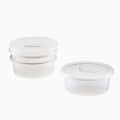 Three Anydeli Multipack, 3-Pack round clear reusable food storage containers with matching white lids are displayed on a plain white background. Two of the containers are stacked together, while the third is placed separately to the right.