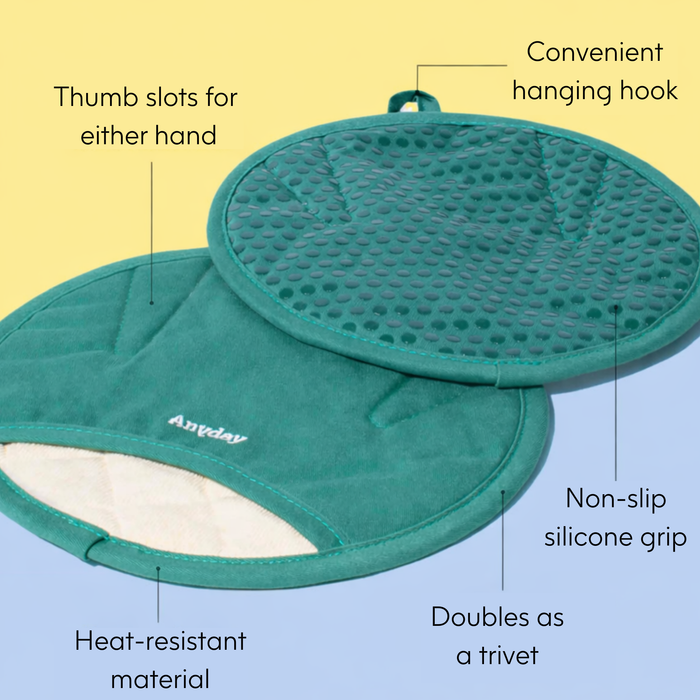 Two green Anyhand Mitts feature thumb slots, a convenient hanging hook, non-slip silicone grips, and heat-resistant material. Text on the image highlights these features—including how the Anyhand Mitt fits any hand and can double as a heat-resistant trivet.