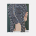 The artwork 'Braids' by Anastasia Korsakova features a detailed back view of intricately woven dark grey braids against a deep green background. The oil painting showcases meticulous attention to hair texture and light reflection, with two symmetrical plaits and a defined center part. The subject wears a white garment, creating striking contrast with the detailed hair study.