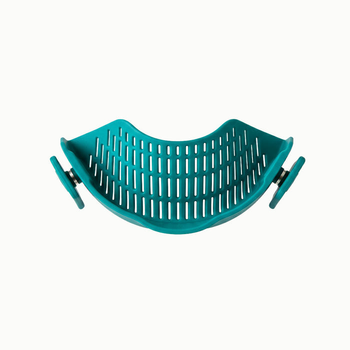 The Clip-on Strainer is a turquoise plastic strainer featuring slotted holes and two adjustable side clips that easily attach to pots or pans for convenient draining—a perfect alternative to a traditional colander, making every meal an Anyday dish.