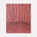The artwork 'Comfort Zone' by Anastasia Korsakova features a textured oil painting depicting vertical curved lines in dusty rose pink tones, resembling velvet upholstery or cushioned panels. A single metallic detail sits centered at the bottom, creating a subtle focal point against the plush, textural background. The composition suggests a close-up view of vintage furniture or architectural detail.