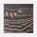 The artwork 'Her Hair' by Anastasia Korsakova depicts flowing waves of dark brown hair with intricate brushstrokes creating a silky, undulating texture. Four abstract peach-colored shapes float above the hair waves, suggesting fingertips emerging through the strands. Oil painting technique masterfully captures the glossy, dimensional quality of flowing hair.