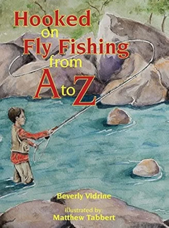 Print cover of Hooked on Fly Fishing from A to Z by Beverly Vidrine featuring a watercolor painting of a young boy fly fishing.