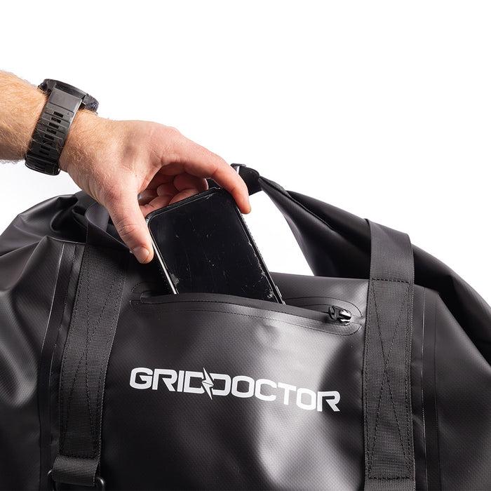 Inserting a phone into the 110L Faraday Bag
