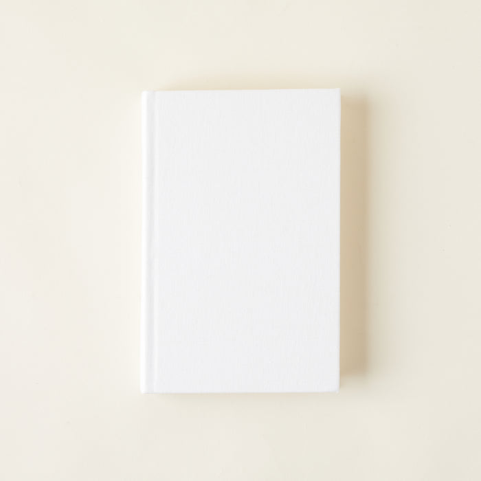 Decorative books with a natural linen cover.