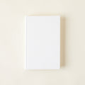 Decorative books with a natural linen cover.