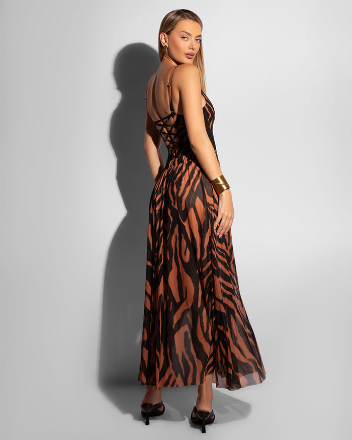Model wears Ringy Sheer Slit Skirty - Baked Clay Zebra Cover Up Midi Skirt and one piece shapewear swimsuit back view