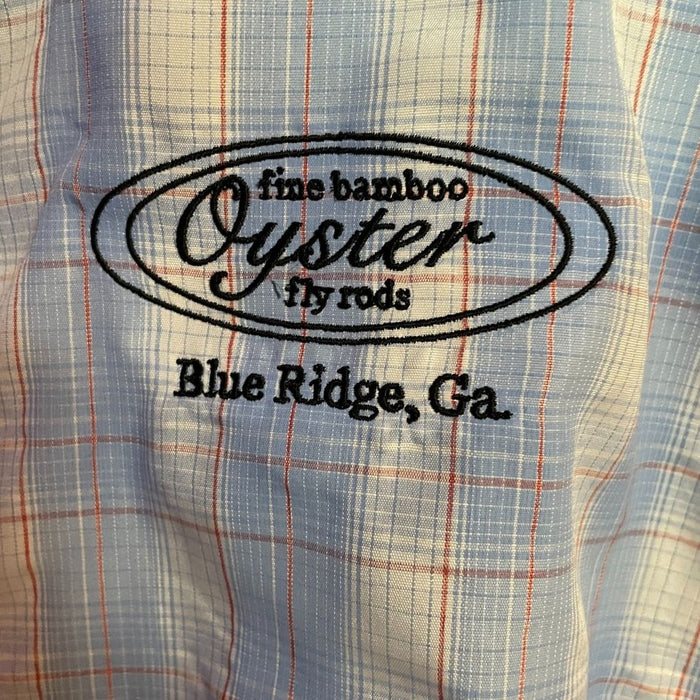 Simms Big Sky Long Sleeve Shirt in sky/flame plaid featuring Oyster fly rods logo.