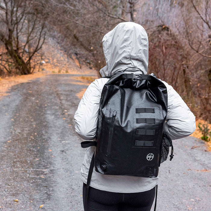 Walking on paved road with waterproof bag